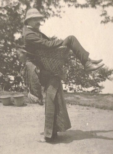 A Sikkimese woman carrying a British man on her back, West Bengal, India, circa 1900. Historical Pics.